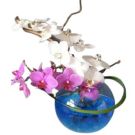 Centrepiece with orchids in a globe vase (diam. 20cm)